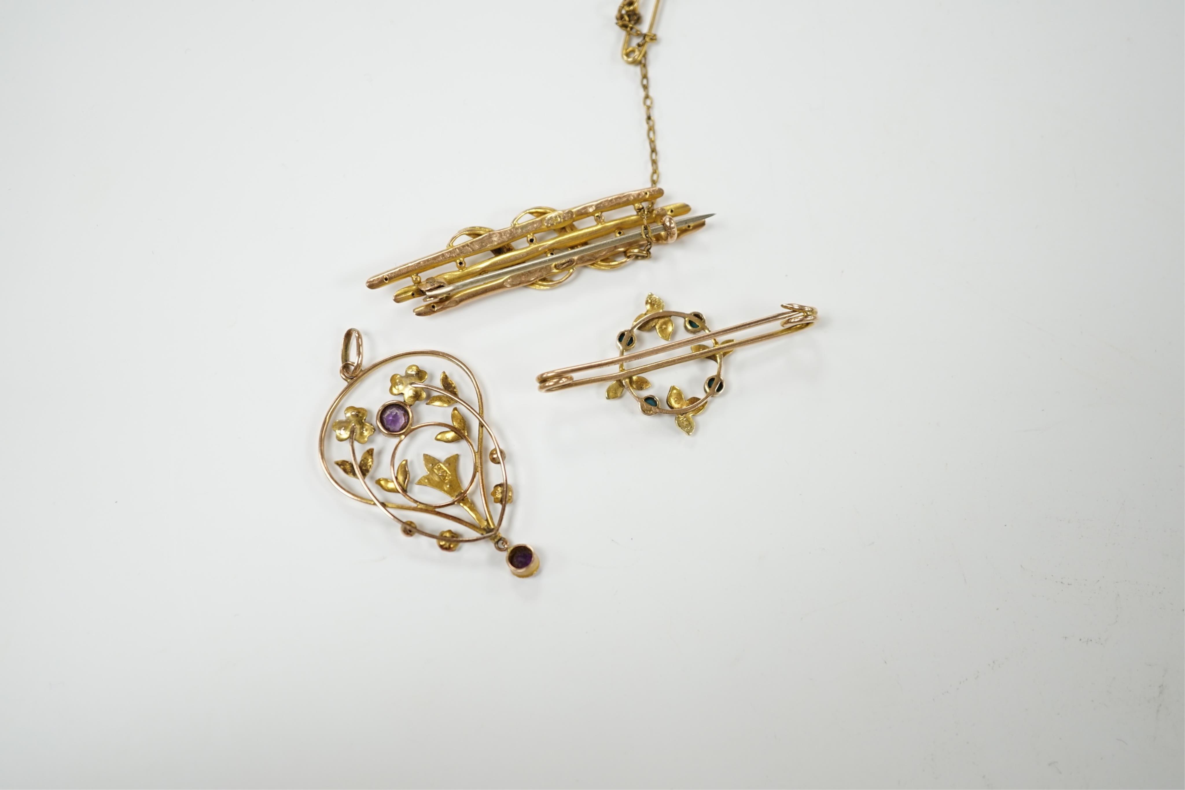 An Edwardian 15ct, turquoise and seed pearl set brooch, 38mm, one other similar yellow metal brooch and a 9ct, amethyst and seed pearl set drop pendant, gross 6.8 grams. Condition - poor to fair